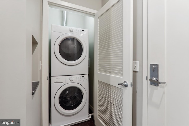 laundry room featuring stacked washer and clothes dryer