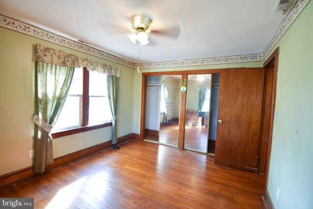 spare room featuring hardwood / wood-style flooring and ceiling fan