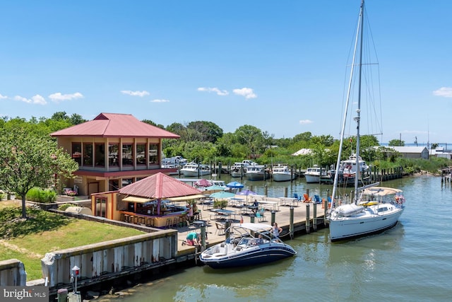 view of dock with a gazebo and a water view