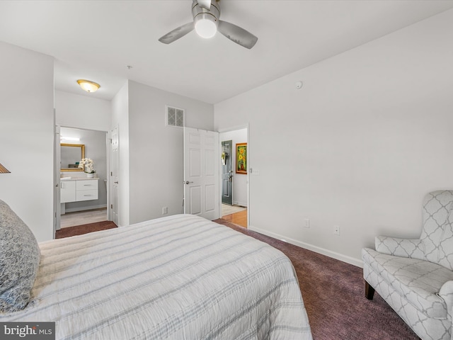 carpeted bedroom with ceiling fan and ensuite bathroom