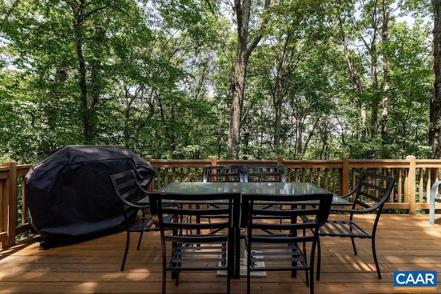 wooden terrace with a grill