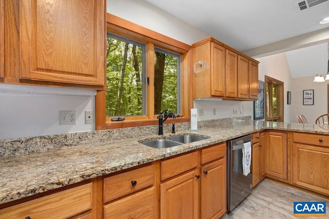 kitchen with a chandelier, light stone counters, stainless steel dishwasher, and sink