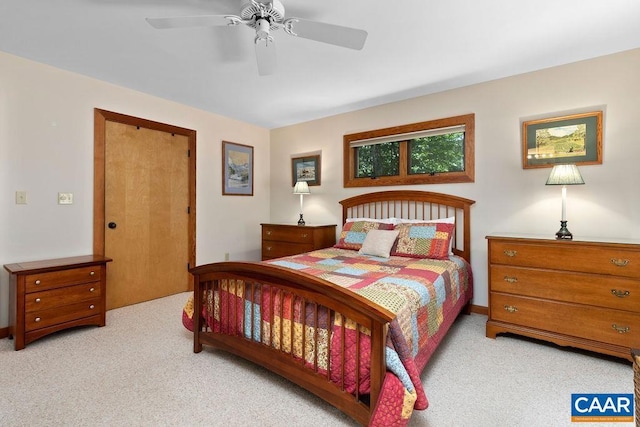 carpeted bedroom featuring ceiling fan