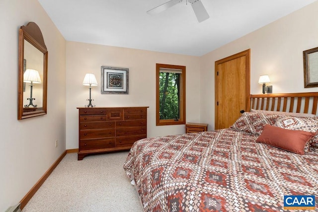 bedroom featuring light colored carpet and ceiling fan