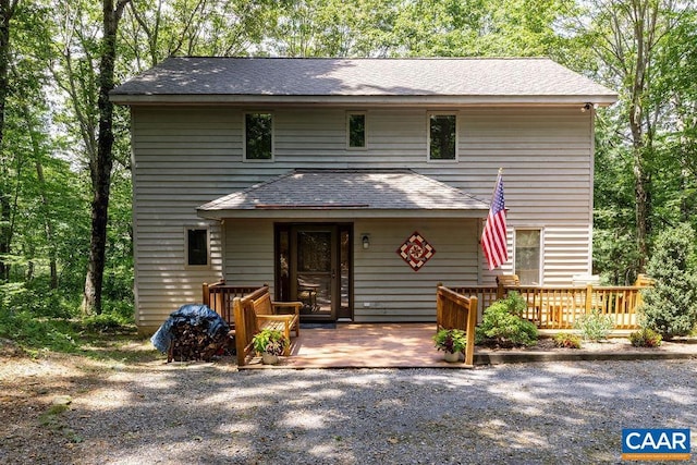 view of front property featuring a wooden deck