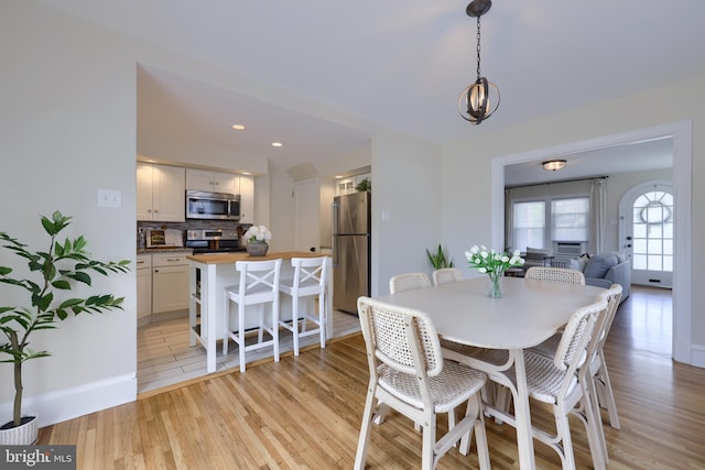 dining space featuring light hardwood / wood-style flooring