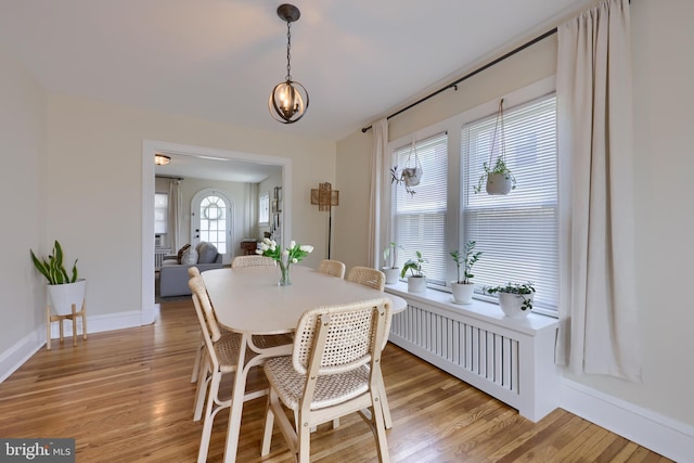 dining area with light wood-type flooring