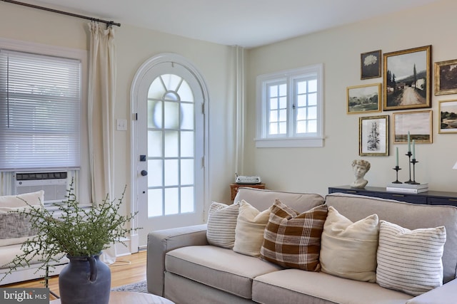 living room with hardwood / wood-style flooring and cooling unit