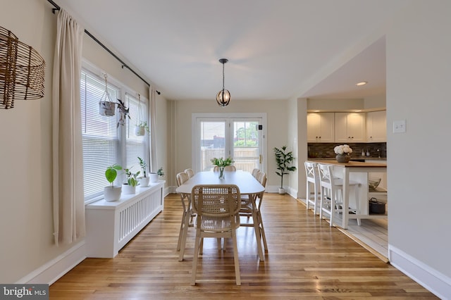 dining room with light hardwood / wood-style floors