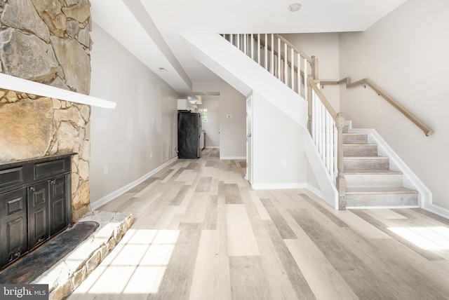 stairs featuring wood-type flooring