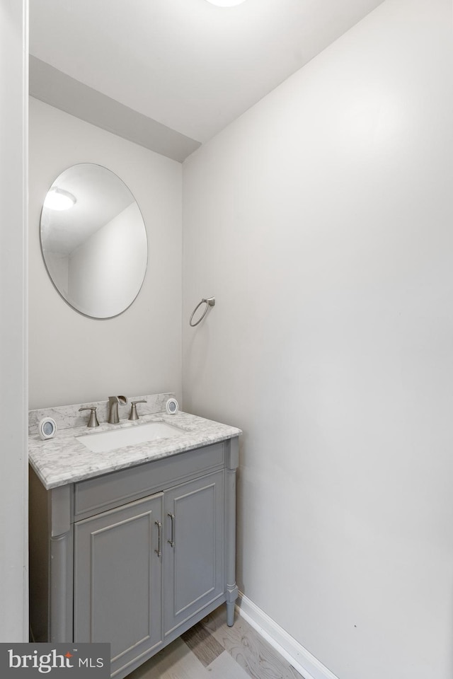 bathroom featuring hardwood / wood-style floors and vanity