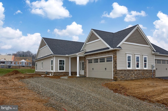 craftsman inspired home with a garage