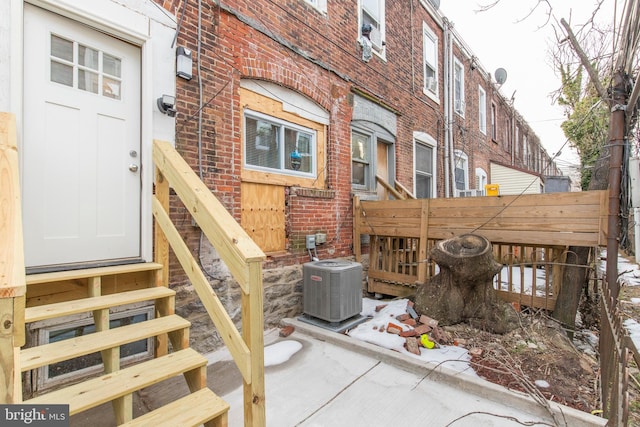 entrance to property featuring central AC