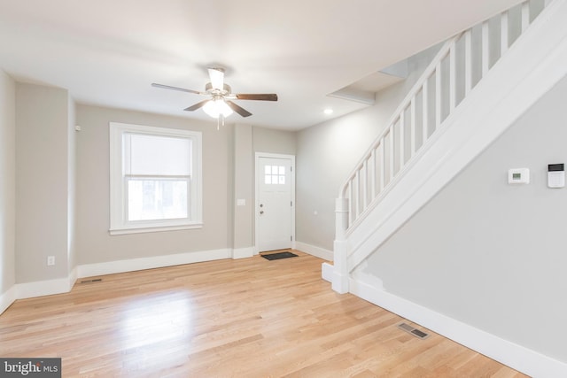 foyer featuring ceiling fan and light hardwood / wood-style floors