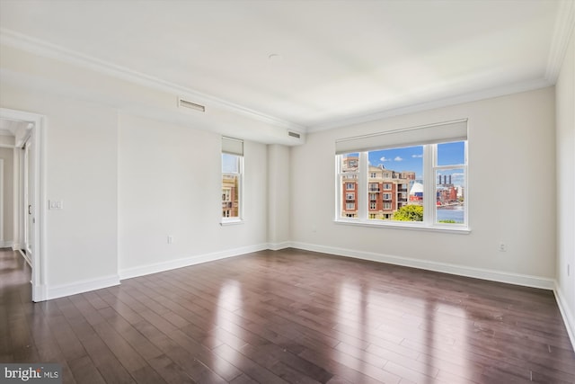 unfurnished room featuring dark hardwood / wood-style floors and ornamental molding