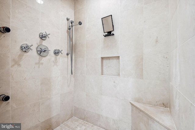 bathroom featuring tiled shower