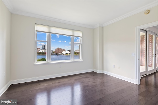 unfurnished room featuring dark hardwood / wood-style flooring, a water view, and crown molding