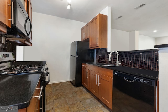 kitchen featuring backsplash, sink, and black appliances