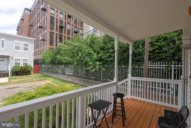 wooden terrace featuring covered porch