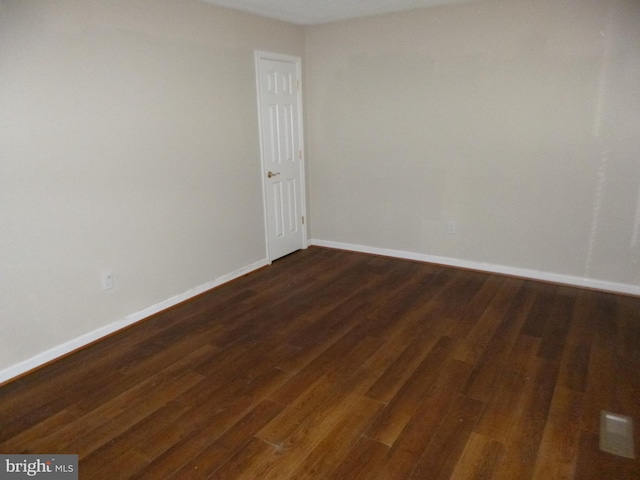 empty room featuring dark hardwood / wood-style floors