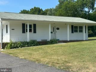 ranch-style house with a front lawn