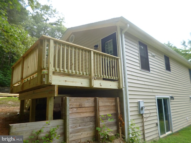 view of property exterior featuring a wooden deck