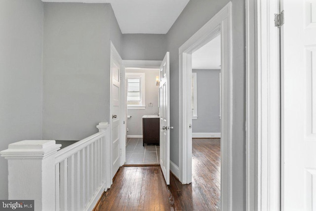 hallway featuring dark wood-type flooring