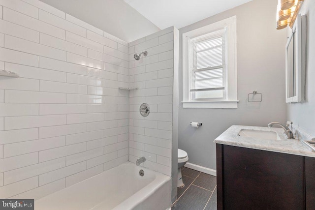 full bathroom featuring tile patterned floors, vanity, toilet, and tiled shower / bath