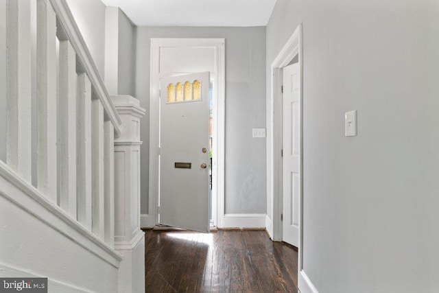 entryway with dark wood-type flooring