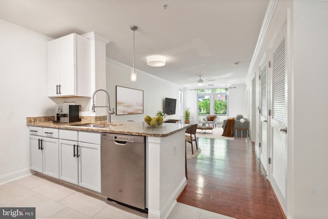 kitchen with ceiling fan, white cabinets, light wood-type flooring, sink, and dishwasher