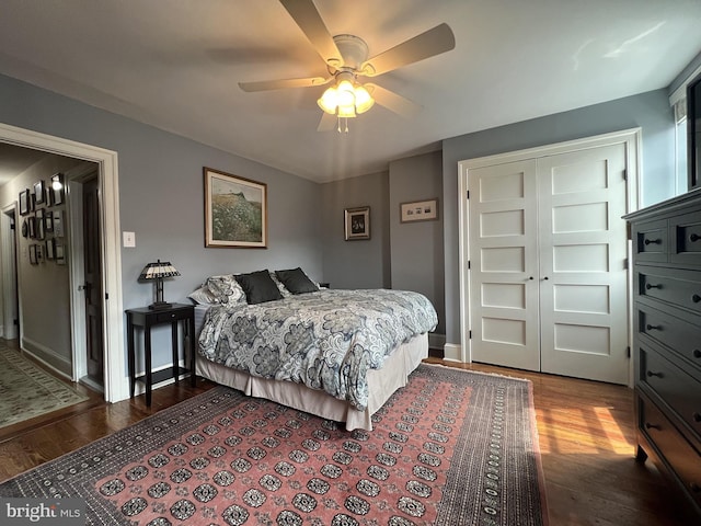 bedroom featuring wood-type flooring, a closet, and ceiling fan