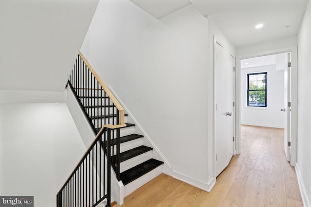 staircase featuring hardwood / wood-style flooring