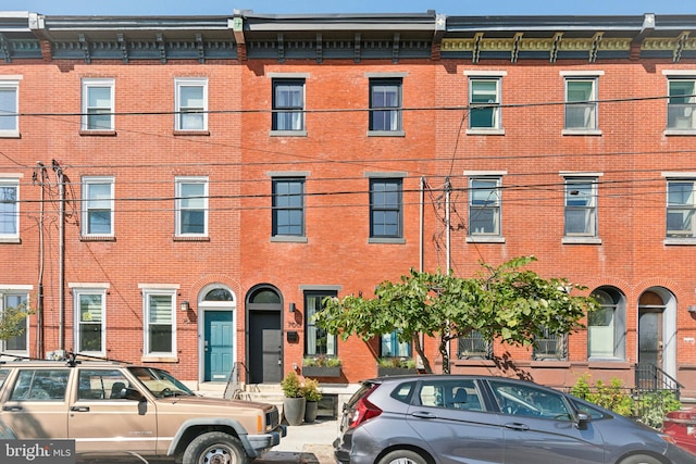 view of front of home with brick siding