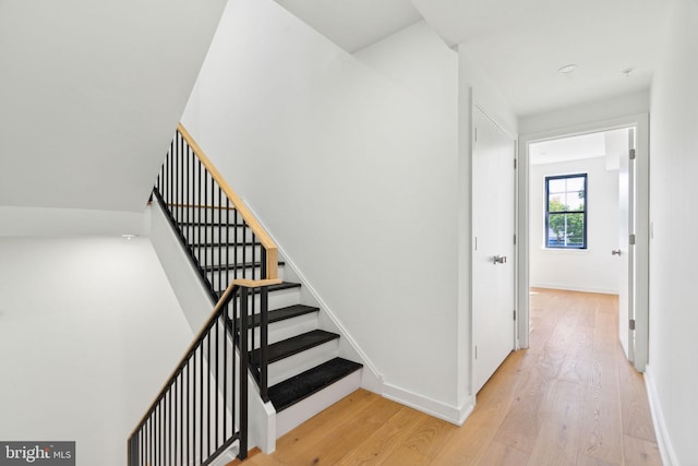 stairs with wood-type flooring