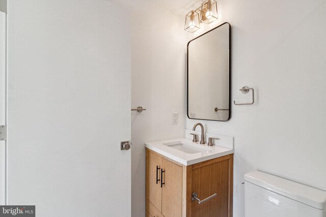 bathroom with tile patterned floors, plus walk in shower, and vanity