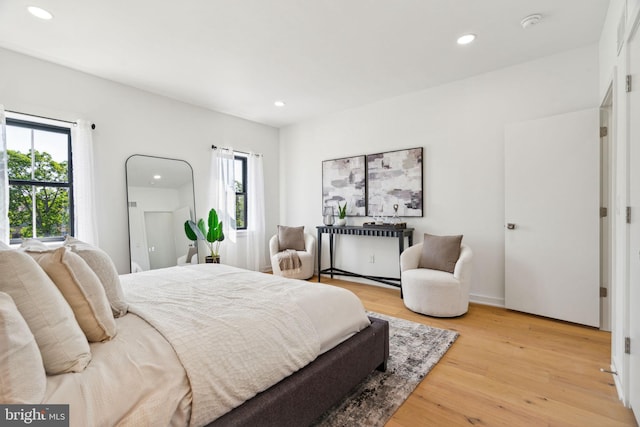 bedroom with light hardwood / wood-style floors