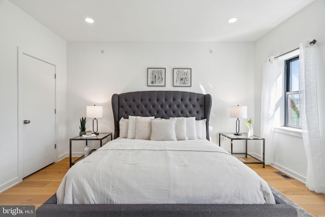 bedroom with light hardwood / wood-style floors