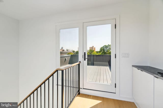 doorway featuring french doors and light hardwood / wood-style floors