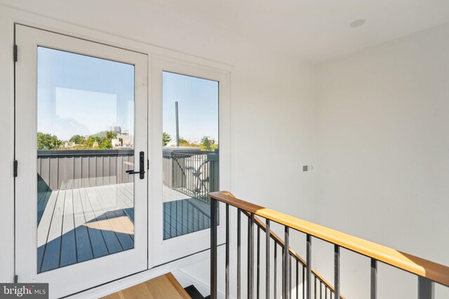 doorway to outside featuring light wood-type flooring and french doors