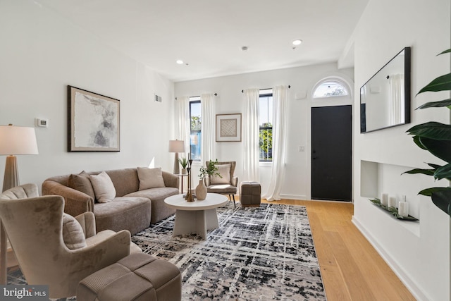 living room with light hardwood / wood-style flooring