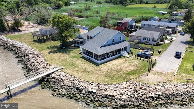 drone / aerial view with a water view