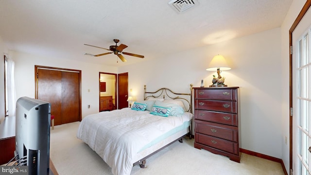 bedroom featuring light colored carpet and ceiling fan