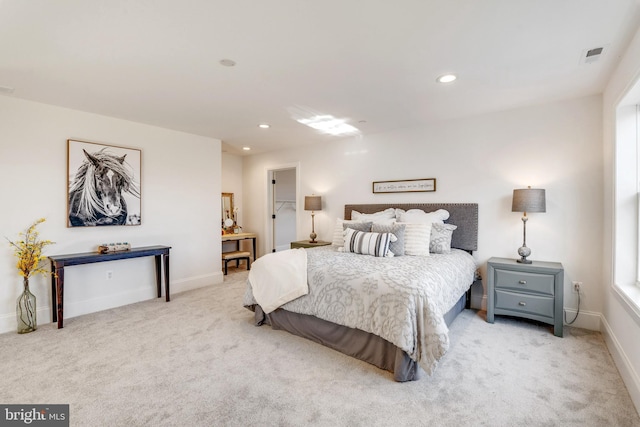 bedroom with light colored carpet