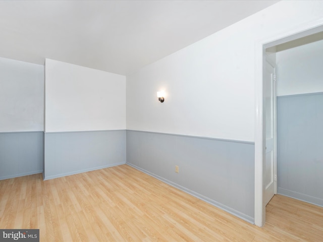 spare room with light hardwood / wood-style flooring