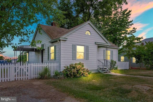 view of front of home featuring a yard