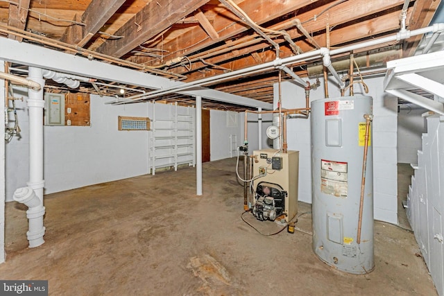 basement featuring electric panel and water heater