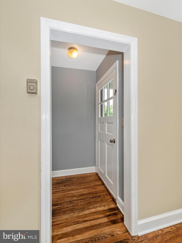 doorway featuring dark wood-type flooring