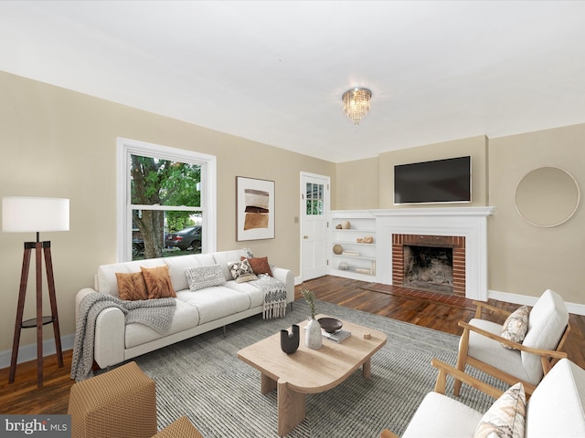 living room featuring a fireplace and dark hardwood / wood-style floors