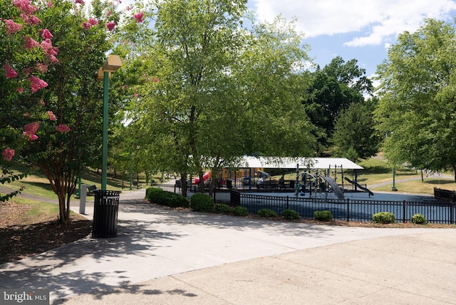 view of property's community with a playground