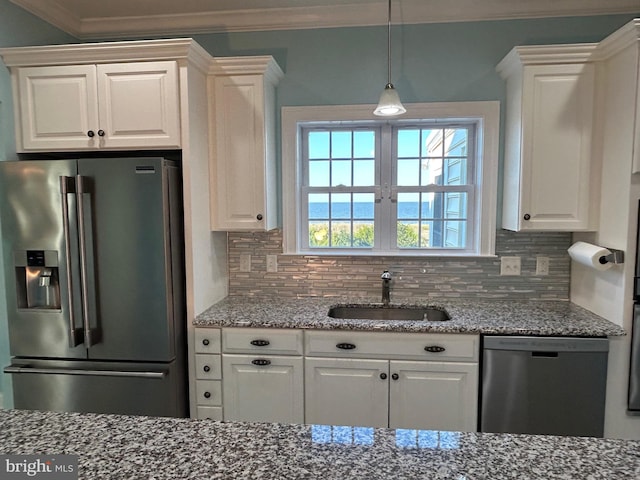 kitchen with sink, light stone counters, decorative backsplash, white cabinets, and appliances with stainless steel finishes